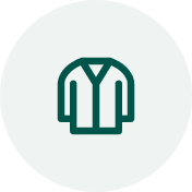 Green icon of a shirt on a white background