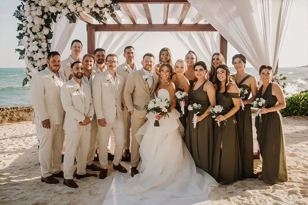 wedding party in sand linen suits with bridesmaids