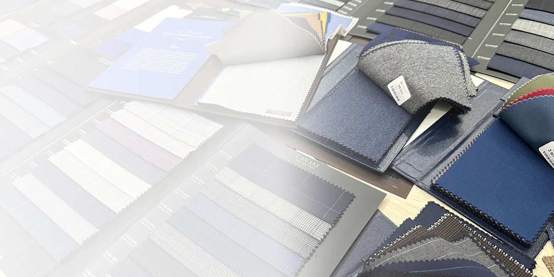 assorted fabrics laid out on table