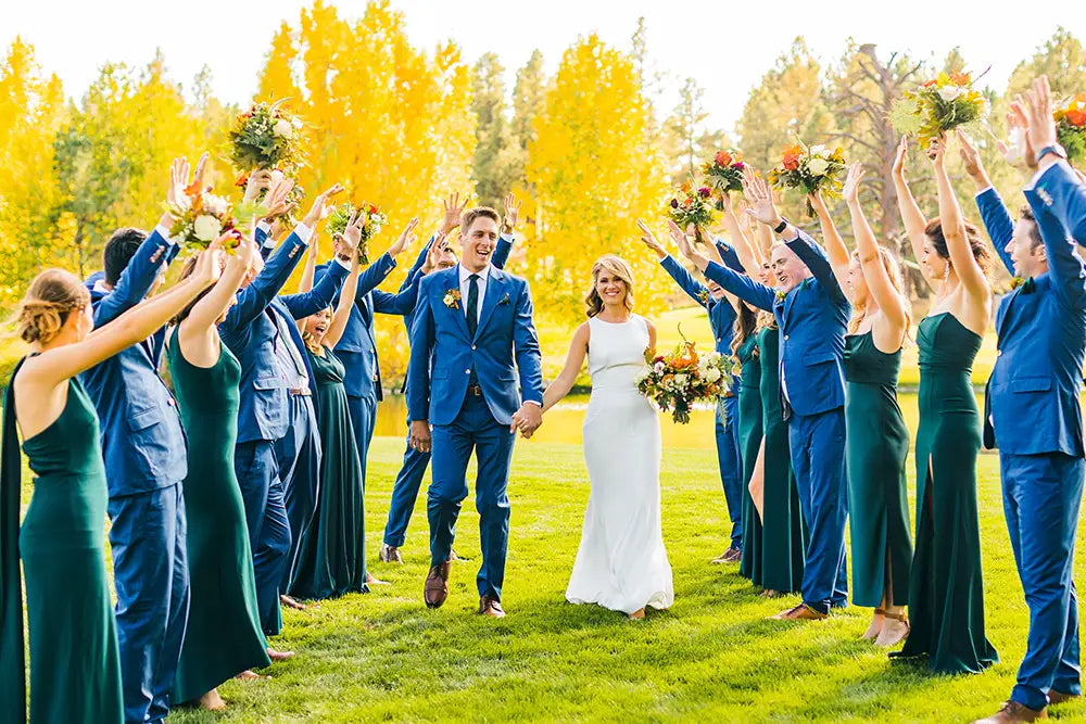 wedding party in blue suits with bride