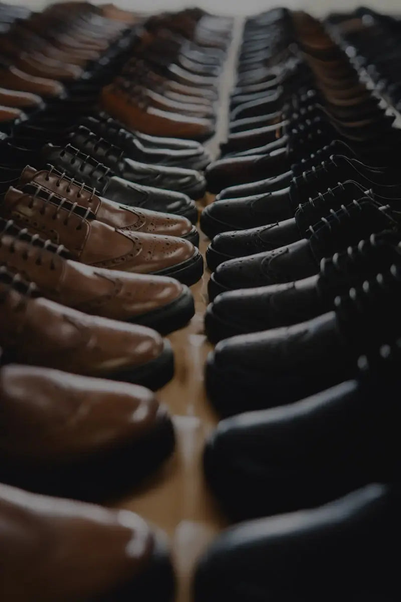 Hilly landscape with fields and a village under a blue sky with clouds