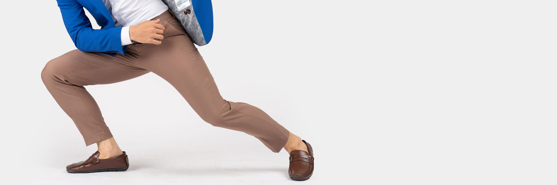 man stretching to the right in his stretch cotton sartoro pants