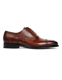 Brown leather dress shoe on a white background