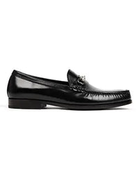 Black leather loafer on a white background