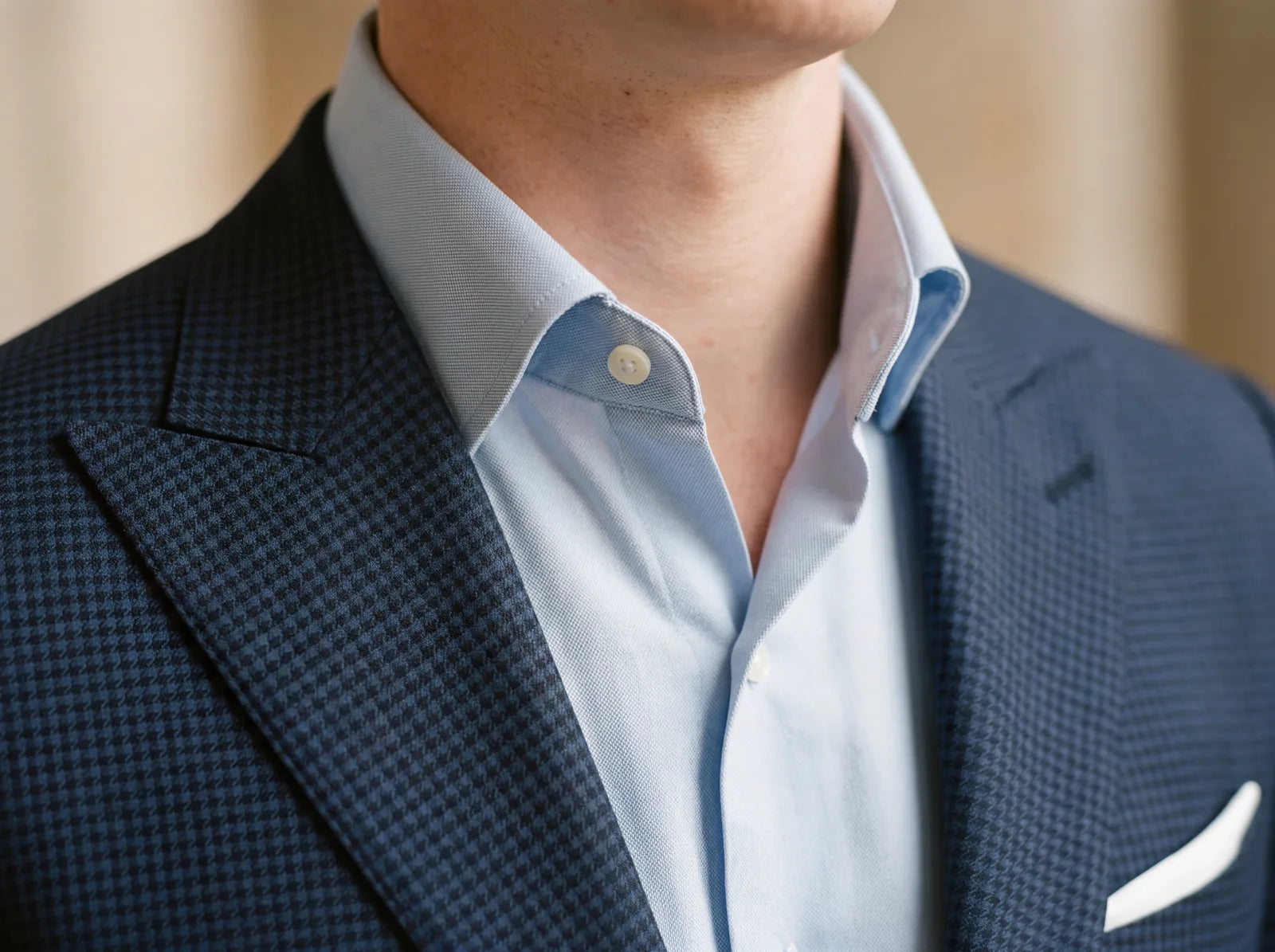 Close-up of a spread shirt collar holding its shape open with no tie