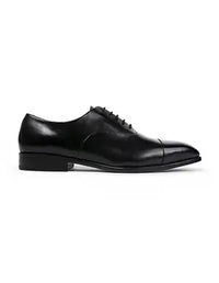 Black leather dress shoe on a white background