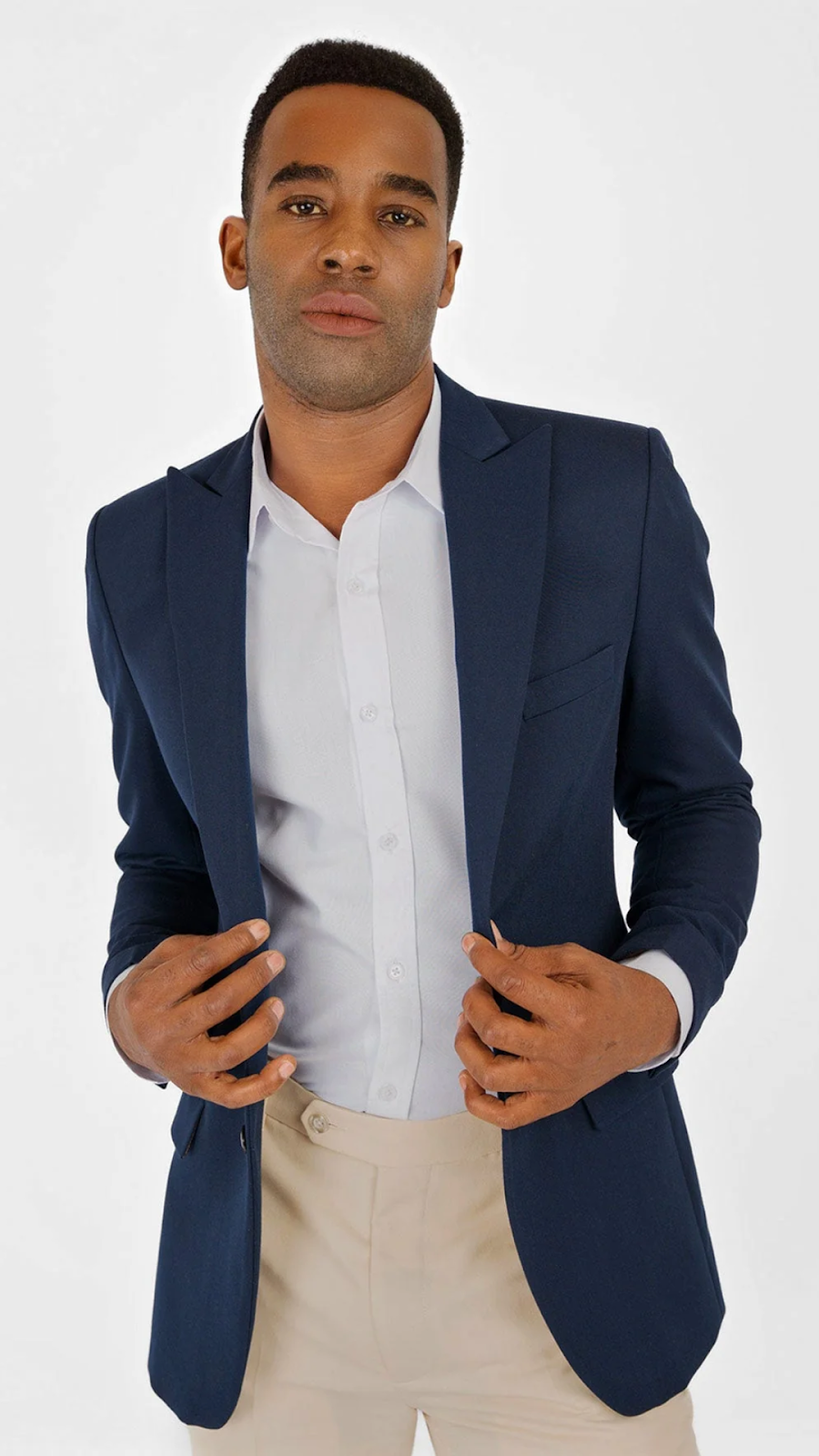 A Male Model Wearing A Blue Suit Jacket
