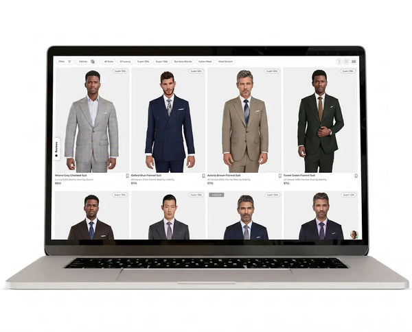 A silver laptop on a white background displaying a website grid of men's suits worn by different models.