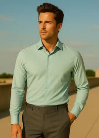 Man in light green shirt outdoors