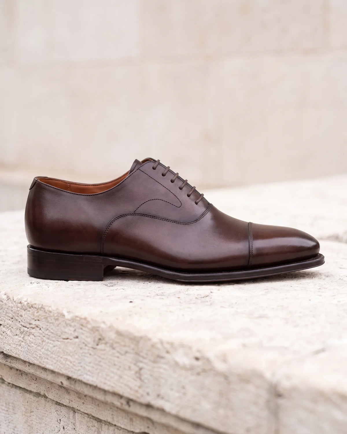 Check the sole and the toe. A slim sole and a gently tapered toe keep a shoe polished, while a chunky sole makes it casual.