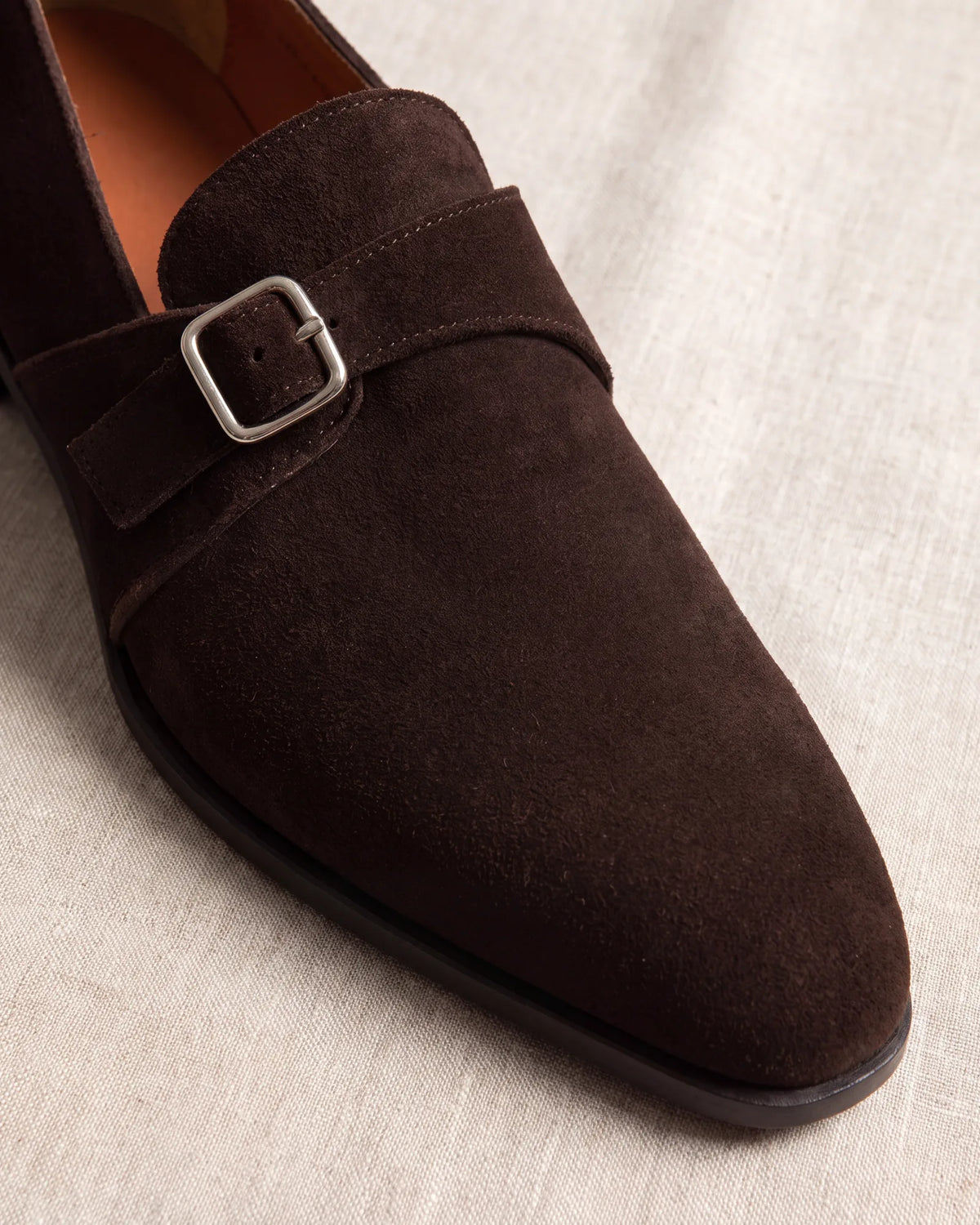 Suede softens any style. A monk strap in smooth calfskin looks more formal than one in suede.