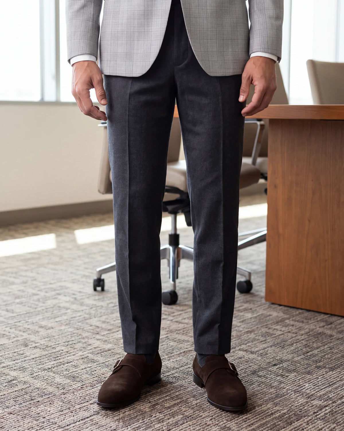 No client meeting today? Brown suede monk straps are enough, worn with charcoal wool trousers and a gray sport coat.