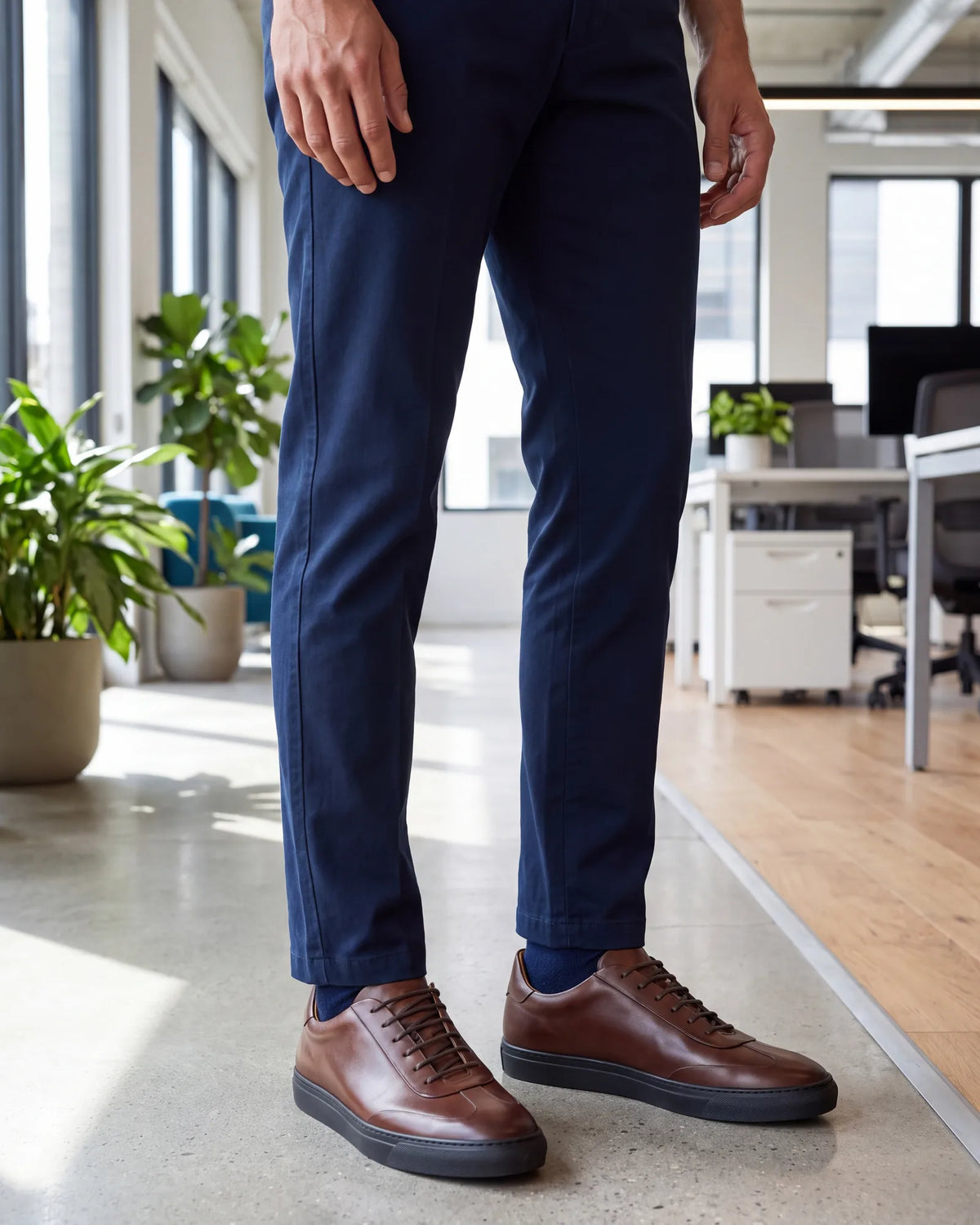 Relaxed office on an ordinary day? That is the one place plain leather sneakers, the least formal style, belong.