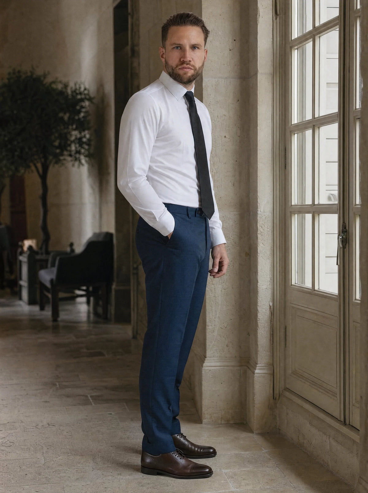 Blue Microcheck Pants worn by a model, townhouse hotel hall349