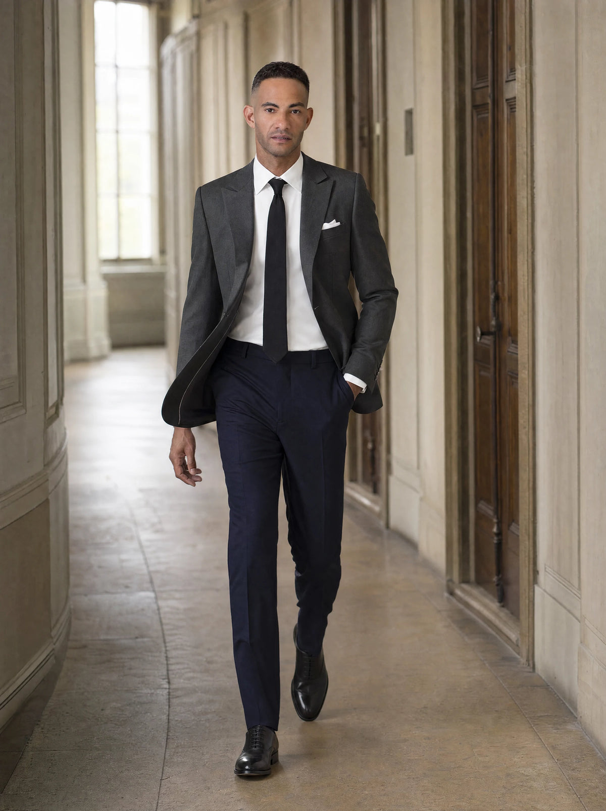 Bryant Charcoal Crosshatch Jacket worn by a model, concert hall corridor25