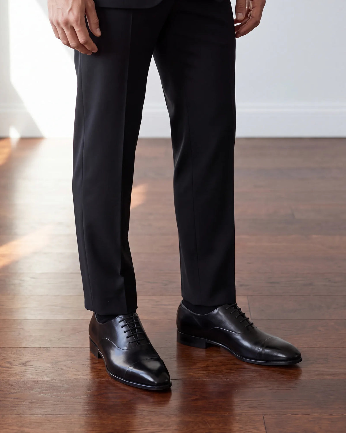 Polish the shoes before you go. Scuffs show at once against black cloth and black leather.