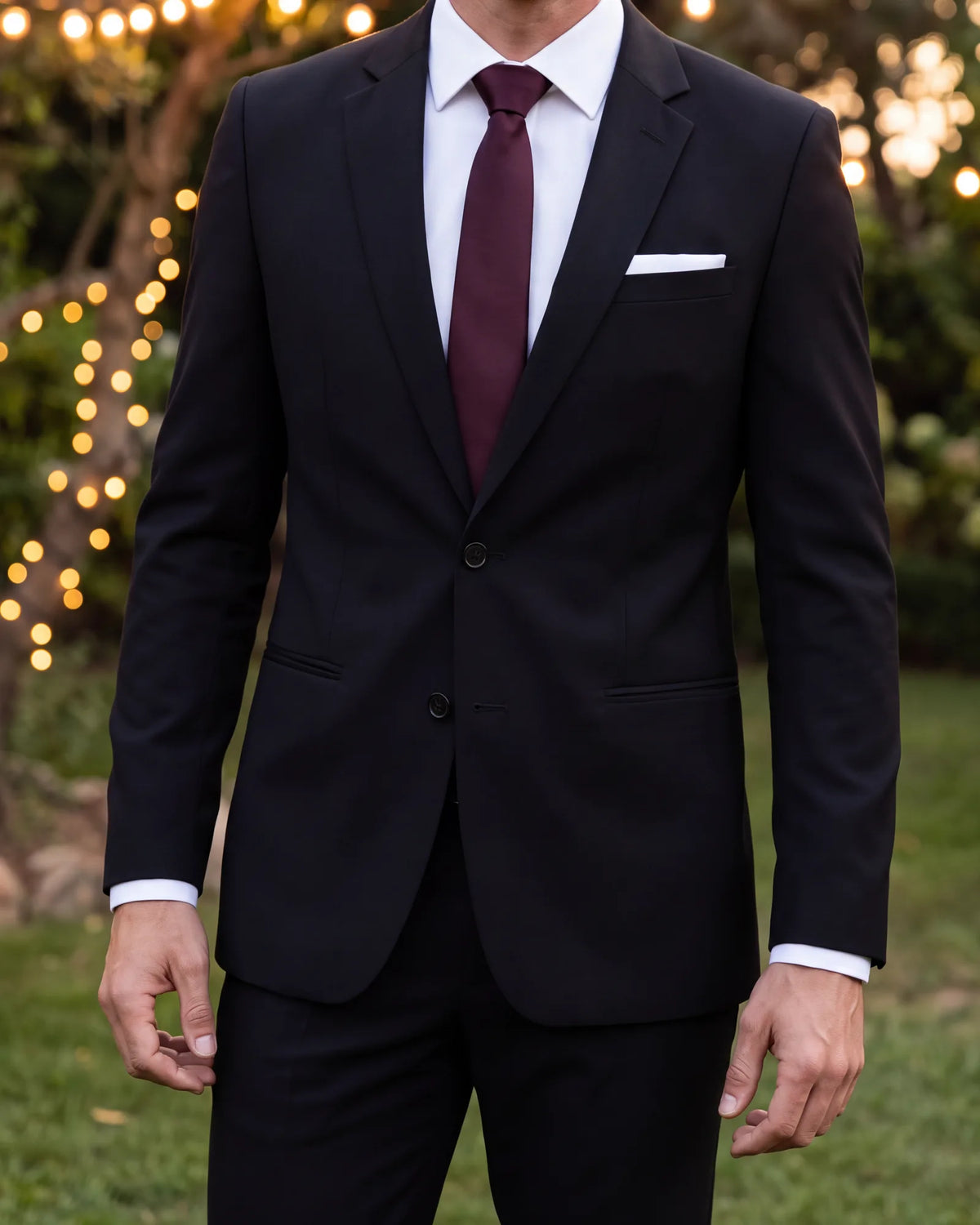 Going to a relaxed evening wedding? Choose burgundy over silver, and finish with a white pocket square.