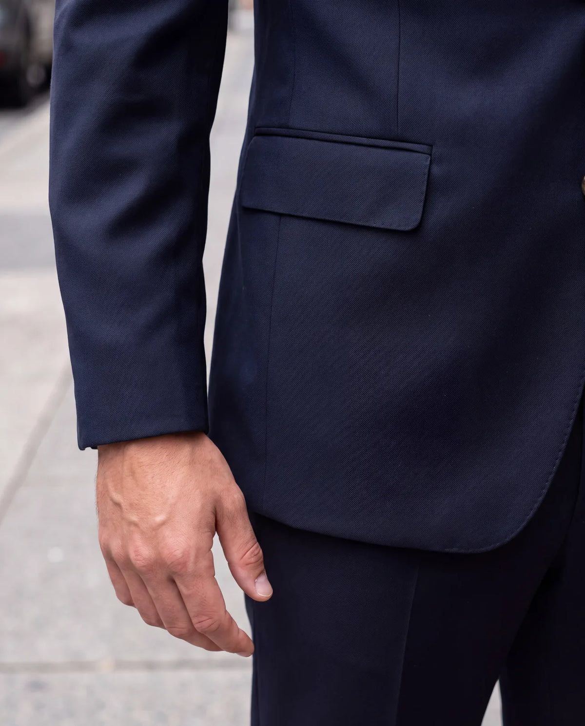 To keep a jacket formal, choose flap pockets over patch pockets, with two side vents and a firm chest.