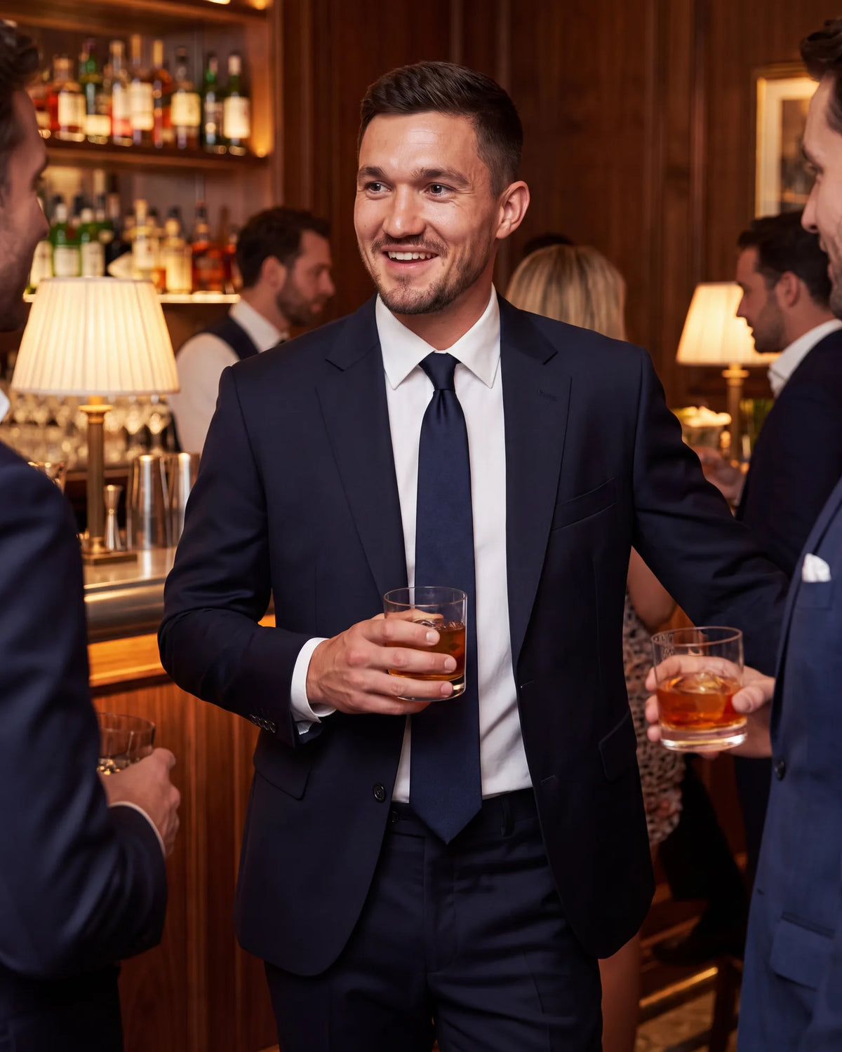 For cocktail attire, choose a dark suit. A tuxedo would overdress most of these evenings.