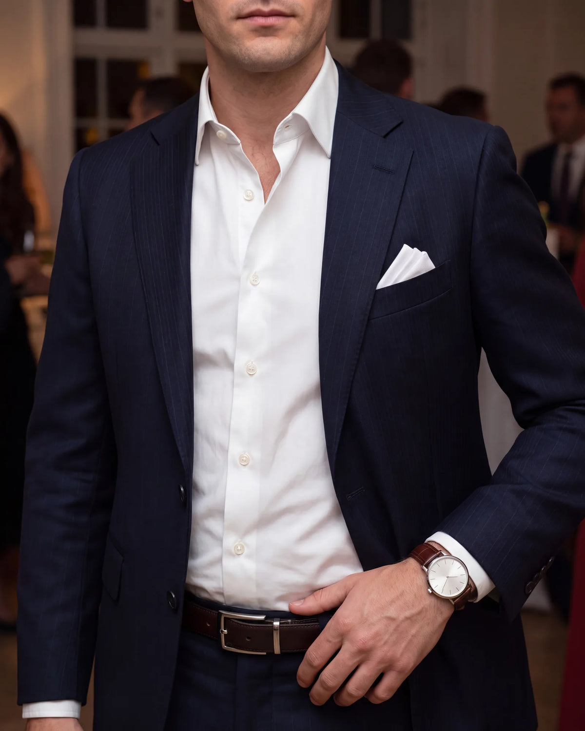 Treat the small pieces as part of the outfit. A crisp shirt, a pocket square, a good belt and a watch separate cocktail attire from office wear.