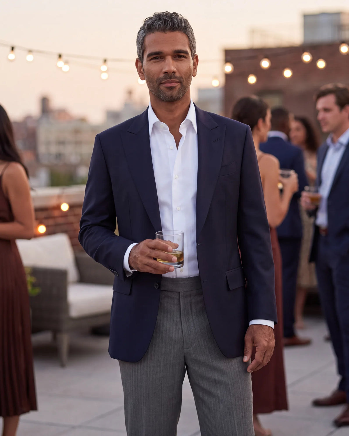 Skipping the matched suit at a relaxed party? Keep both pieces dressy, with a navy jacket over wool dress trousers in another color.