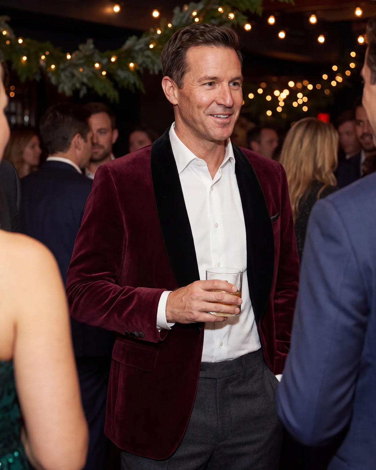 Use a festive invitation as permission for color and texture. A burgundy velvet jacket over dark wool trousers works.