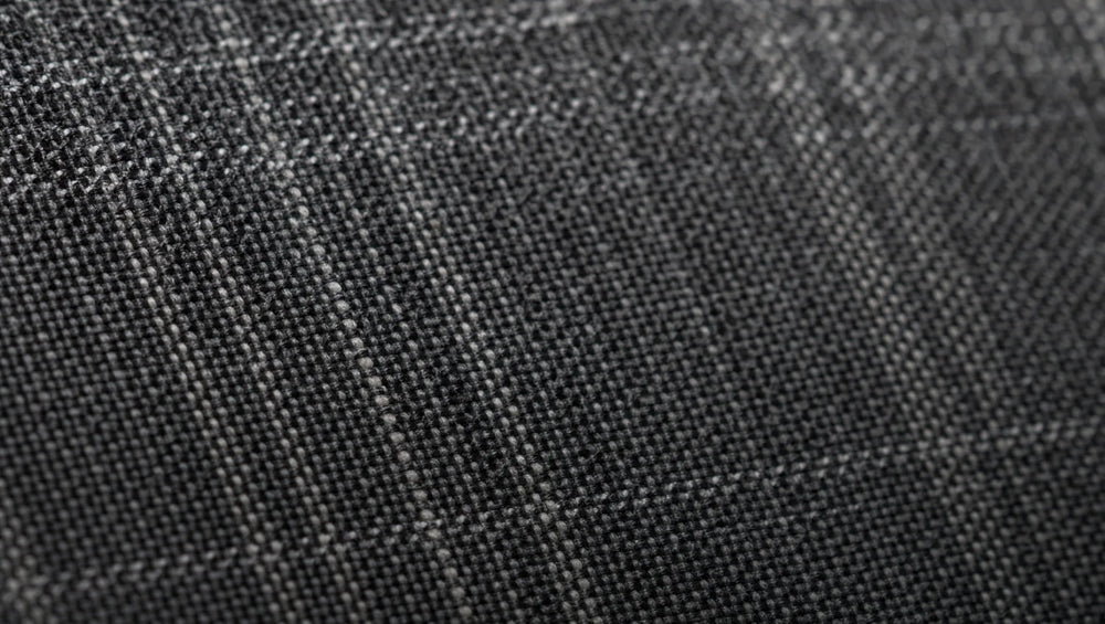 Crosshatch weave detail — alternating light and dark threads create subtle texture that photographs with depth flat charcoal cannot match