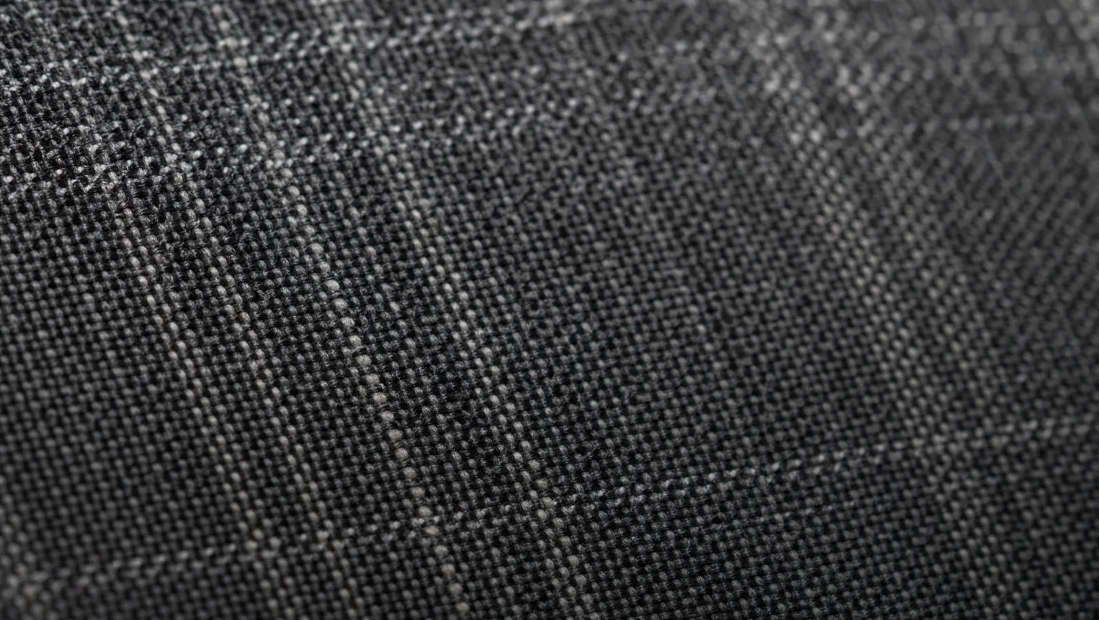 Crosshatch weave detail — alternating light and dark threads create subtle texture that photographs with depth flat charcoal cannot match