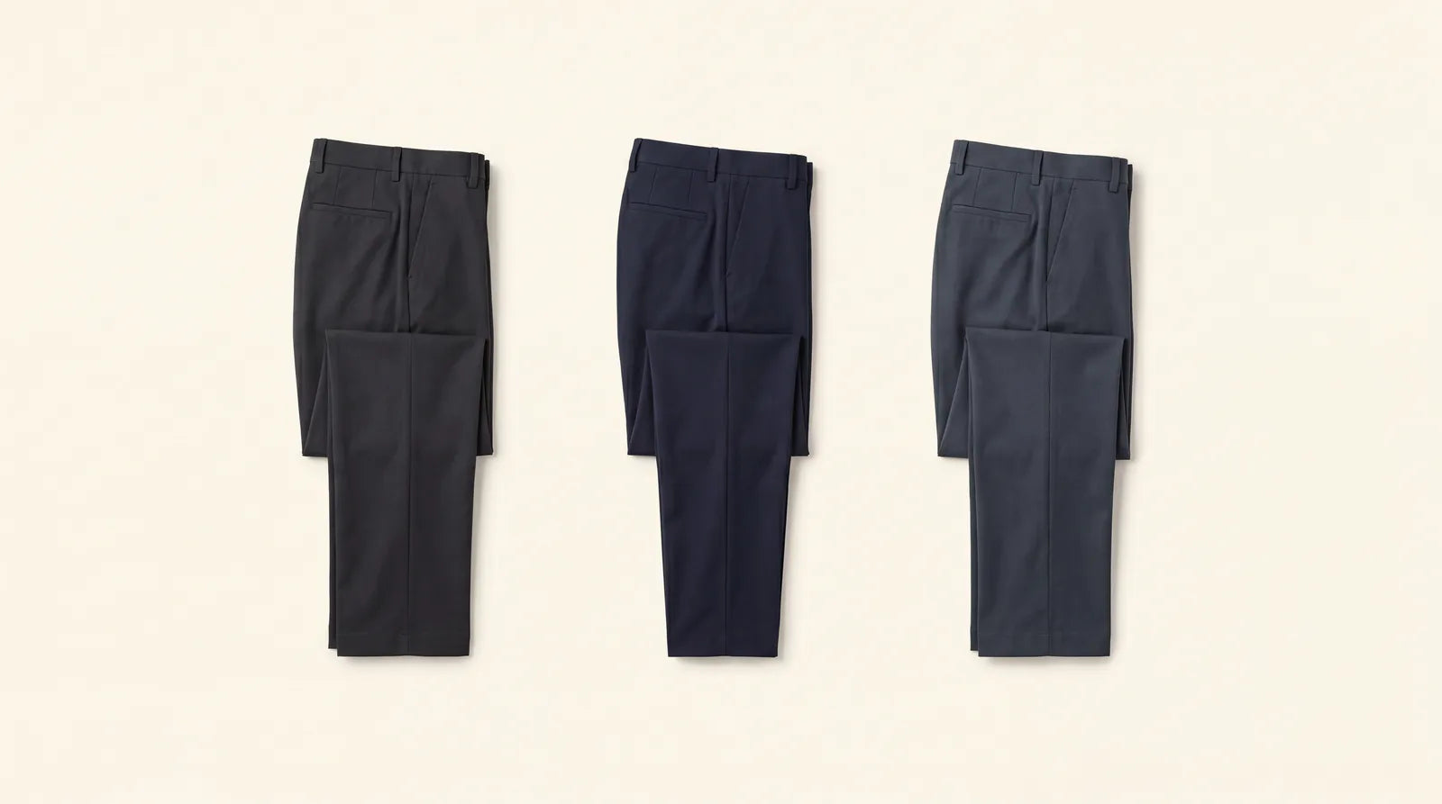 Dark, clean, flat-front trousers that keep the lower half understated