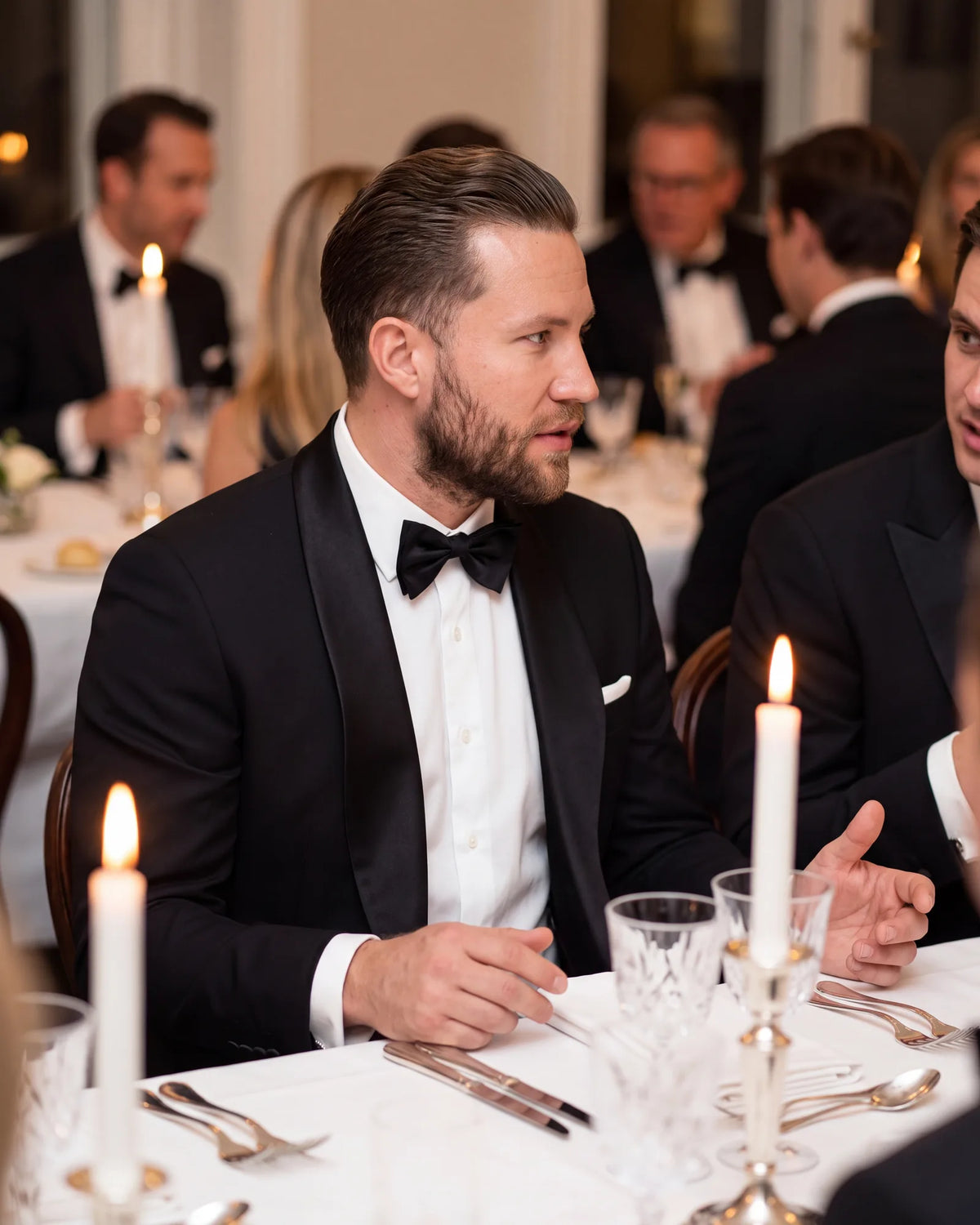 Reading a British dress guide? There, "dinner suit" means a tuxedo for black tie, not a business suit worn to dinner.