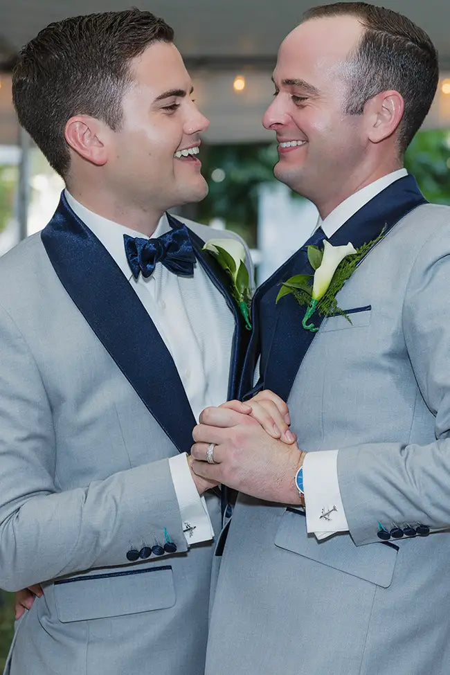 two grooms in grey tuxedos