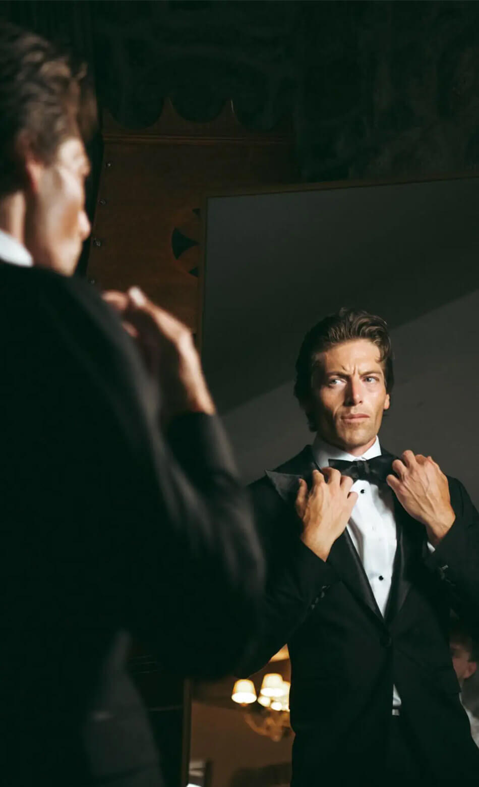 man in black tuxedo in ballroom