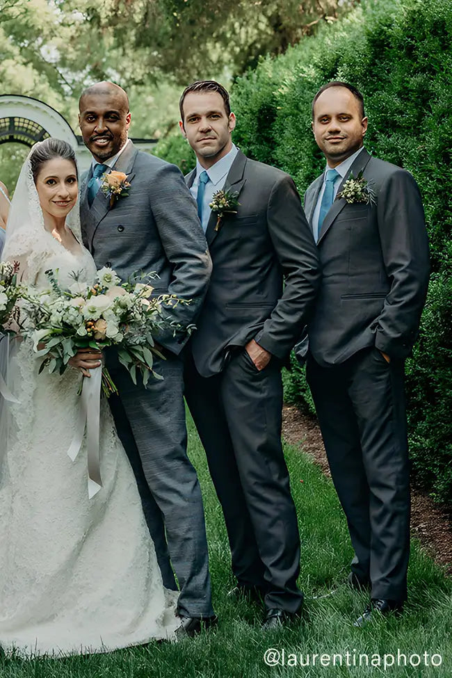 bride with groom and groomsmen in grey suits