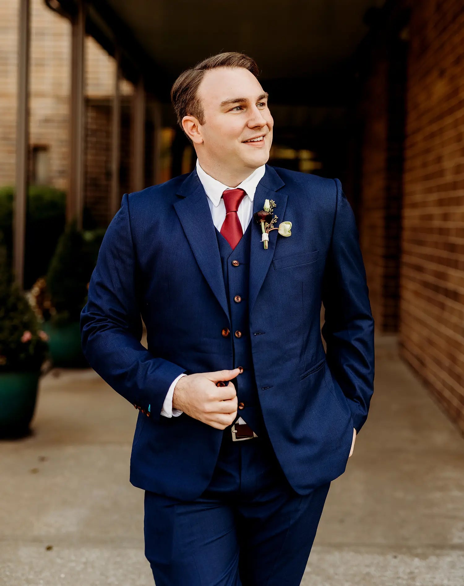 larger man in blue suit