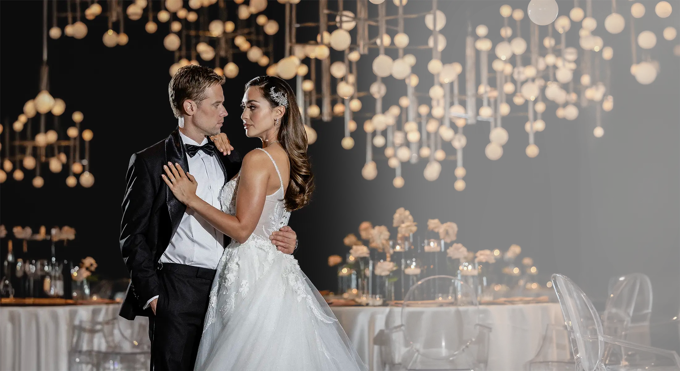 Shaun Sipos in a black Sartoro tux with Lindsey Morgan in wedding dress.