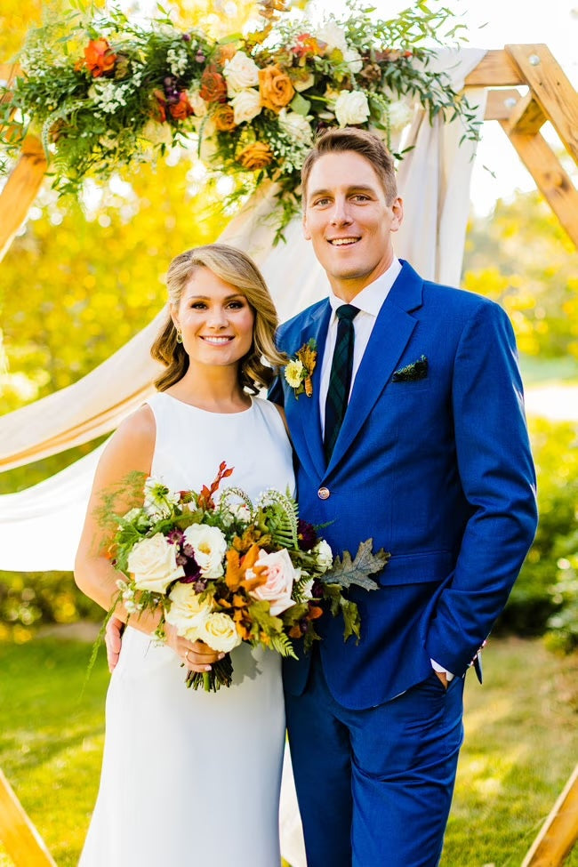 bride and groom in blue suit