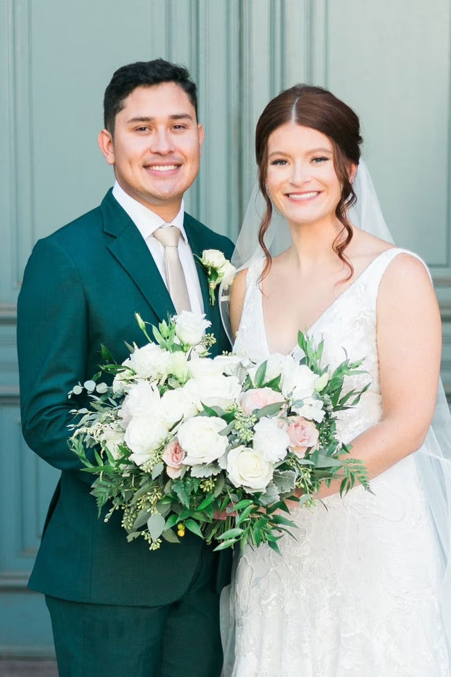 bride and groom in green suit
