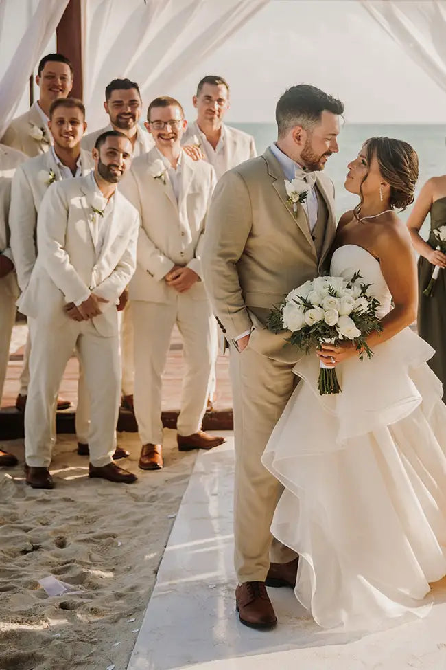 wedding party in sand linen suits