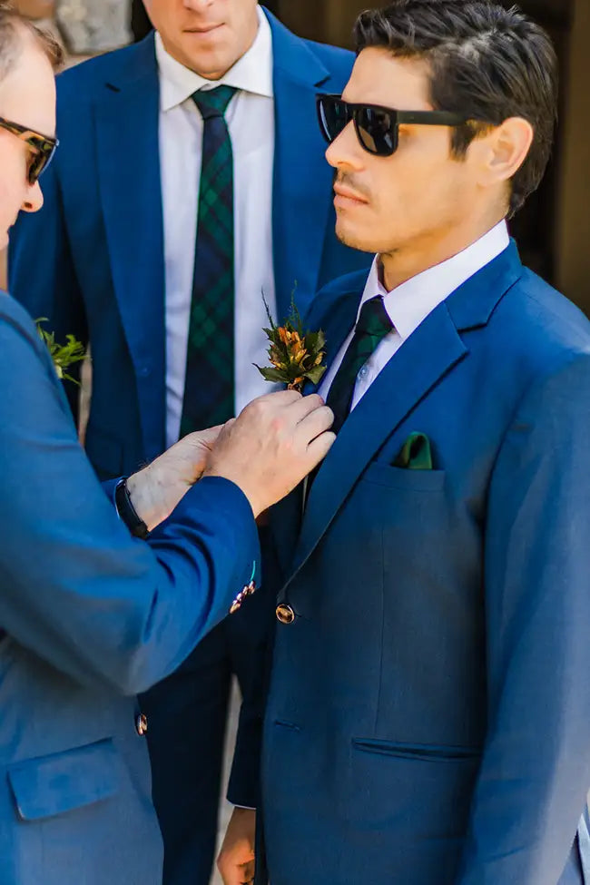 Wedding party in blue suits.