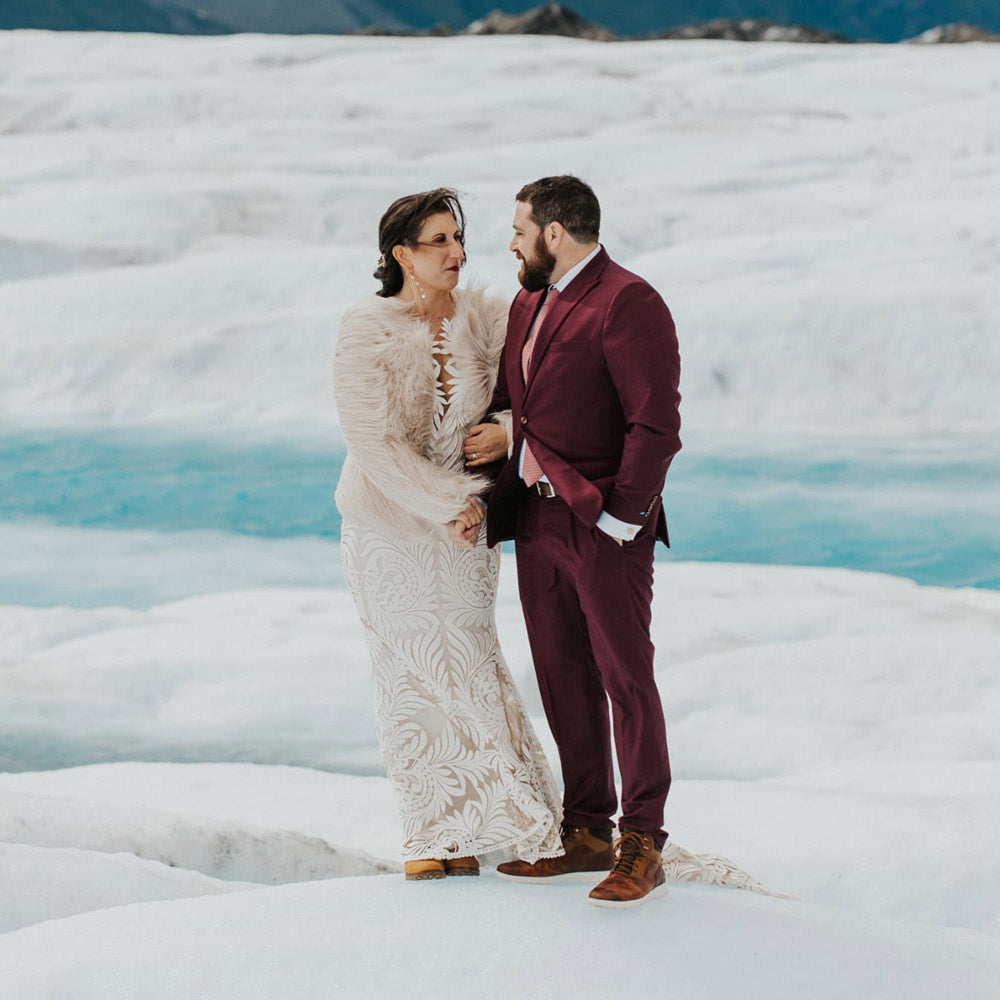 bride and groom shaking hands on a glacier in iceland