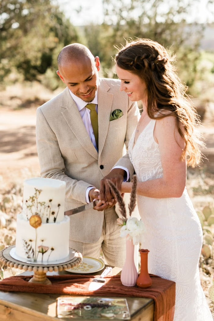 bride and groom in beige suit