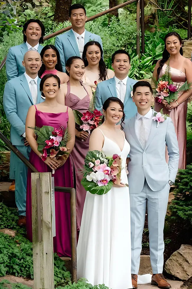 Wedding party in light blue wedding suits.