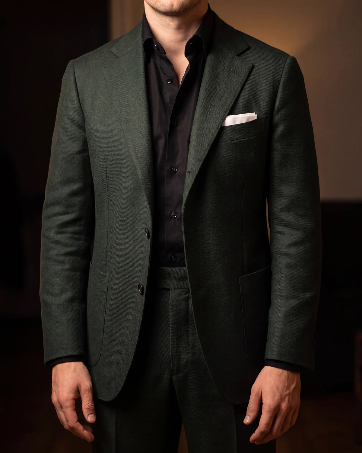 Wearing a black shirt with green? Open the top button and add a white pocket square.