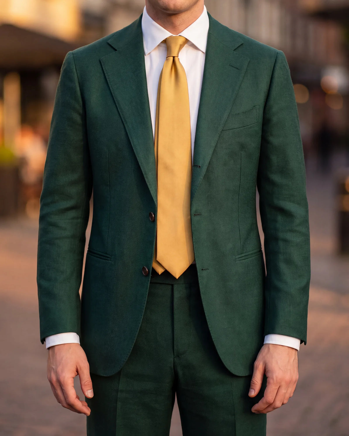 Dressing up an emerald suit for a wedding? Reach for gold, the brighter of the two evening ties.