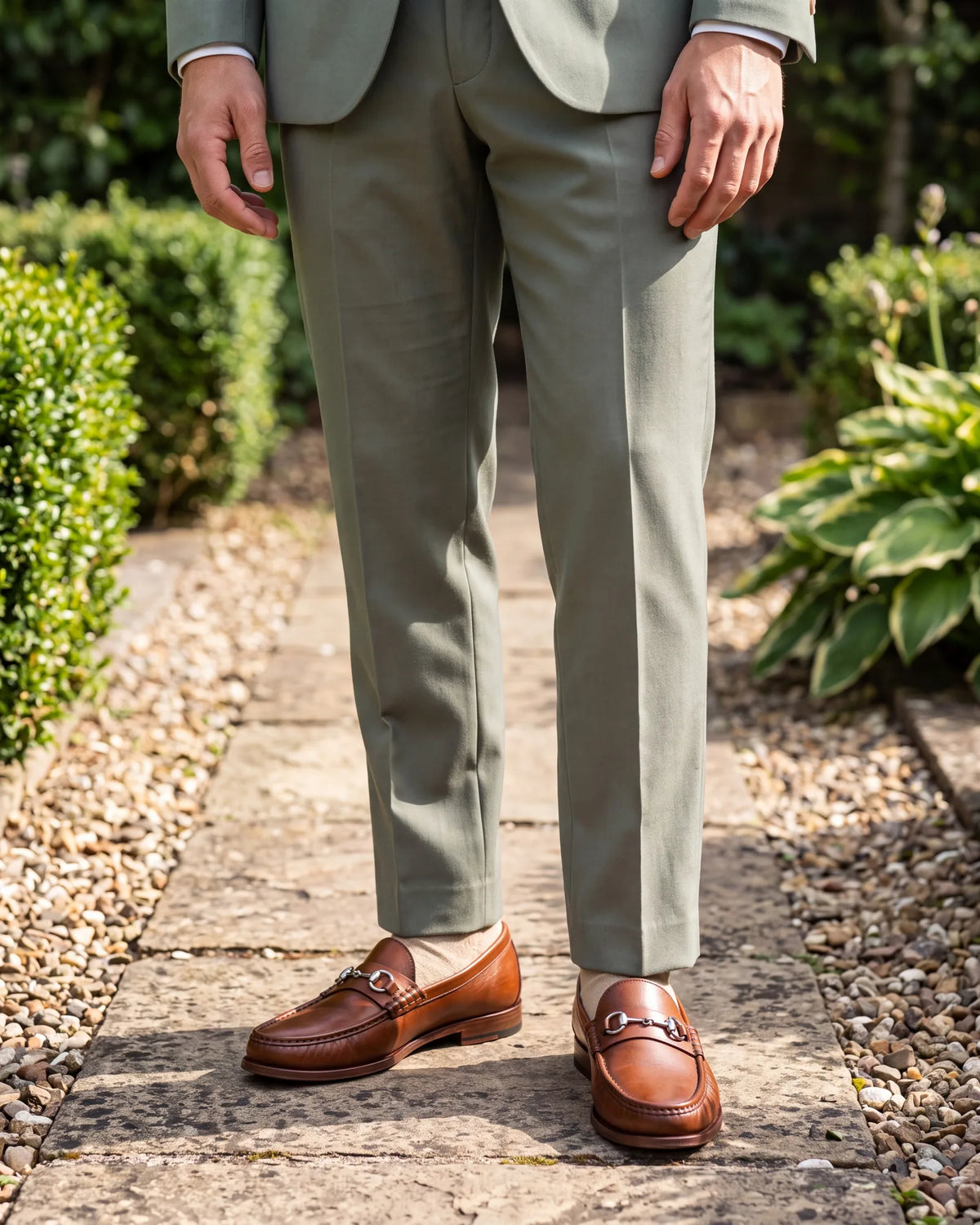 On sage or mint in daylight, tan shoes keep the outfit light.