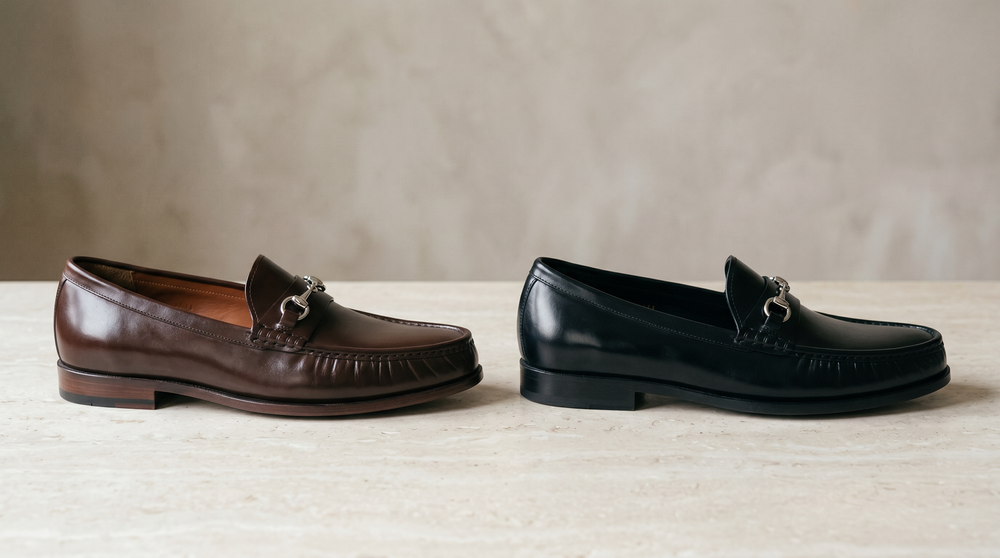 Same horsebit loafer style in dark brown and black side by side, showing how color shifts formality