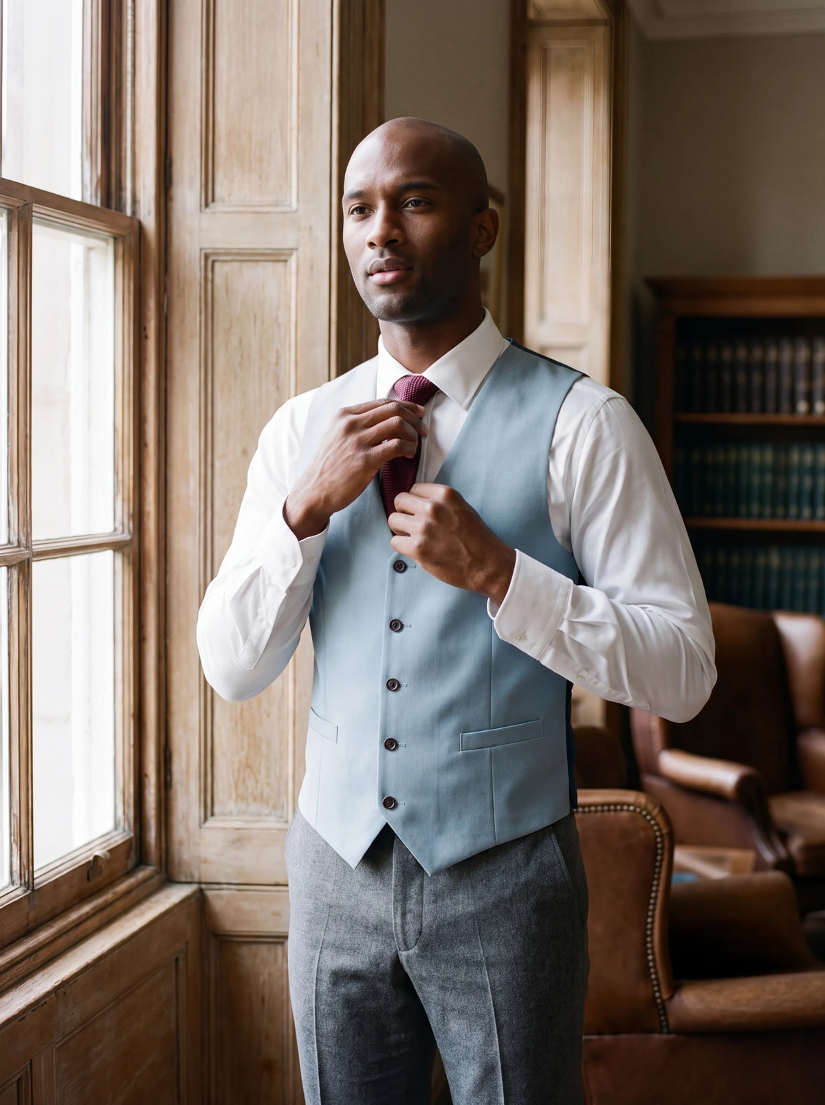 Ice Blue Twill Vest worn by a model, bank office window889