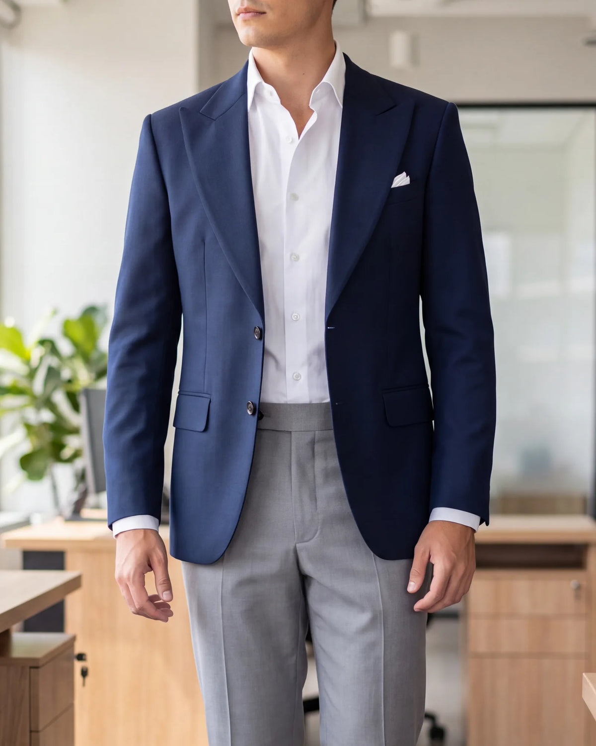 At a business casual office, a sport coat with wool trousers is the right interview level. A shirt and chinos alone fall short.