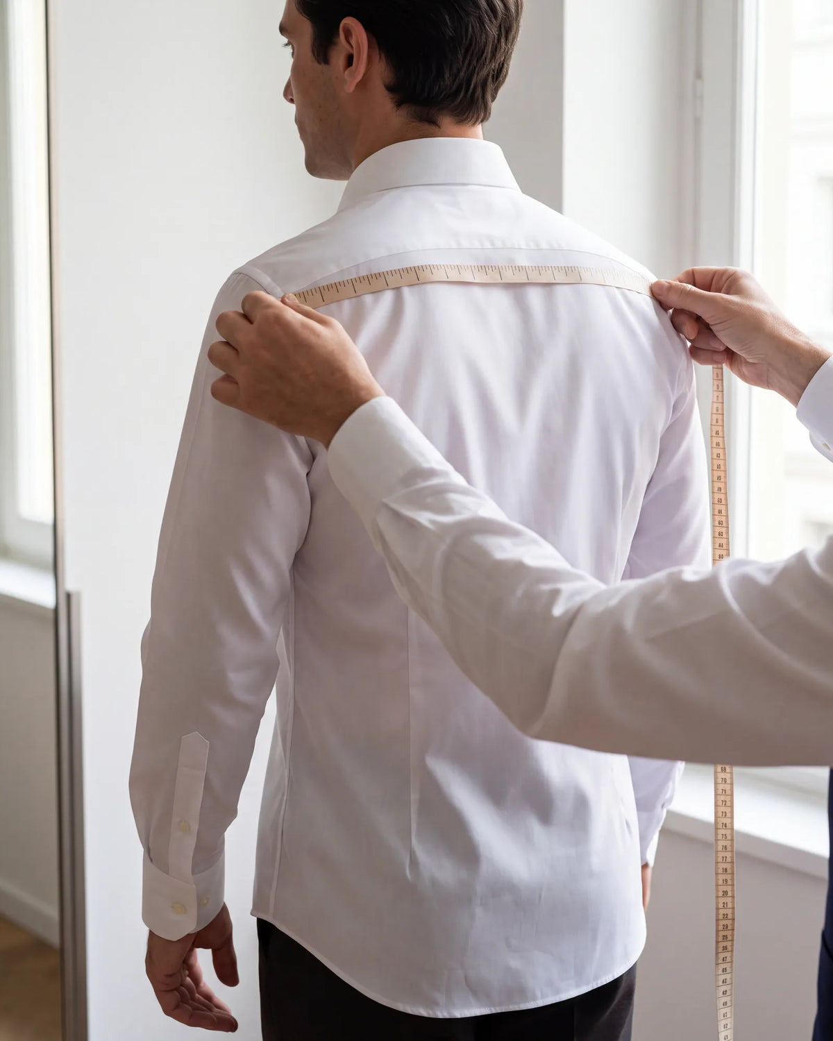 Get measured carefully once. A made-to-measure suit has no fittings to correct a wrong number.