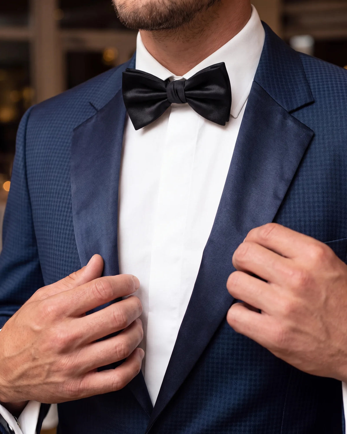 Even with a notch lapel, the satin facing is what marks the jacket as a tuxedo rather than a suit.